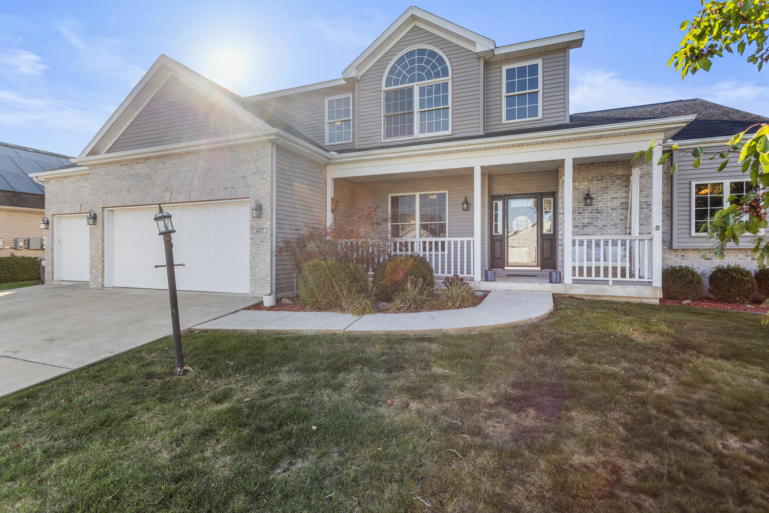 407 West Walnut Street Tolono, IL 61880 - Photo 2 of 15 a front view of a house with a yard