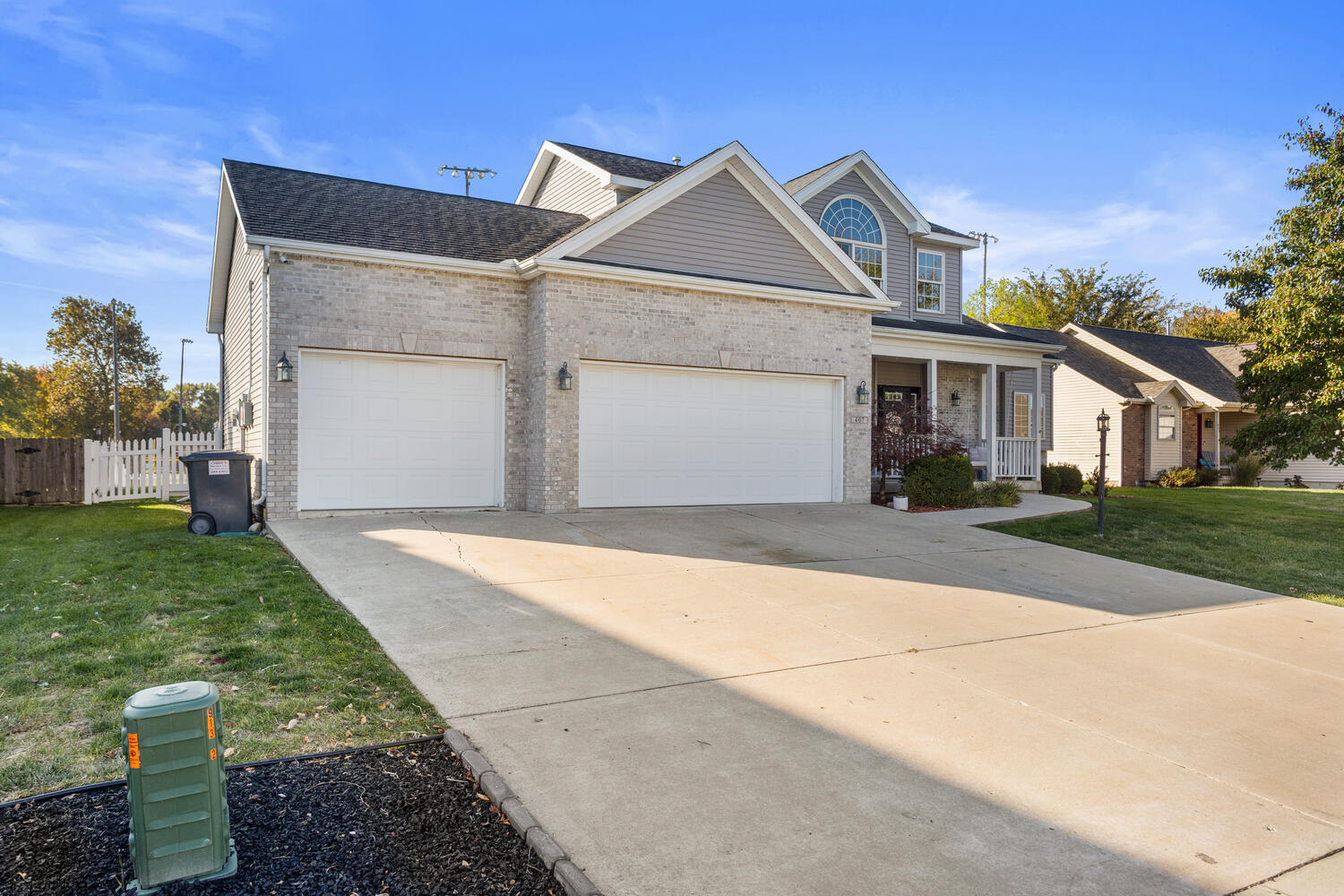 407 West Walnut Street Tolono, IL 61880 - Photo 5 of 15 a front view of a house with a yard