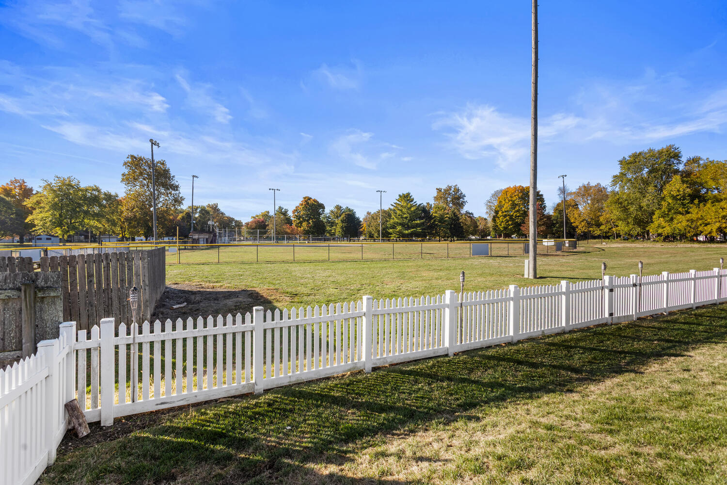 407 West Walnut Street Tolono, IL 61880 - Photo 12 of 15 a view of a yard with wooden fence