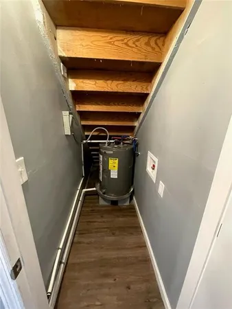 a view of a house with a wooden fence