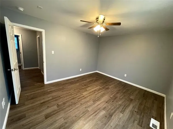 a view of room with window and ceiling fan