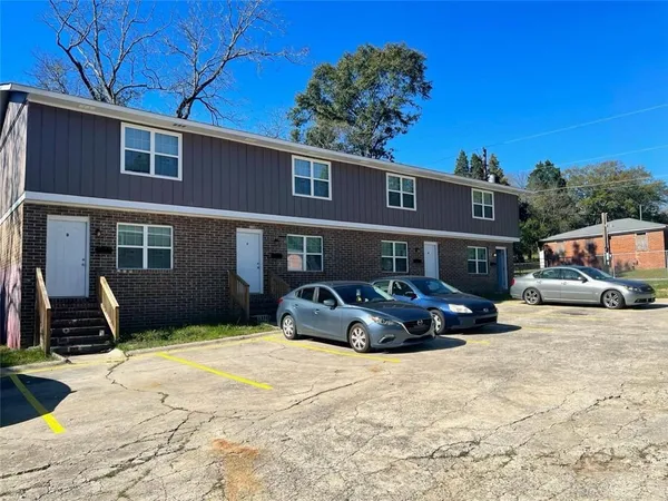 a front view of a house with parking yard