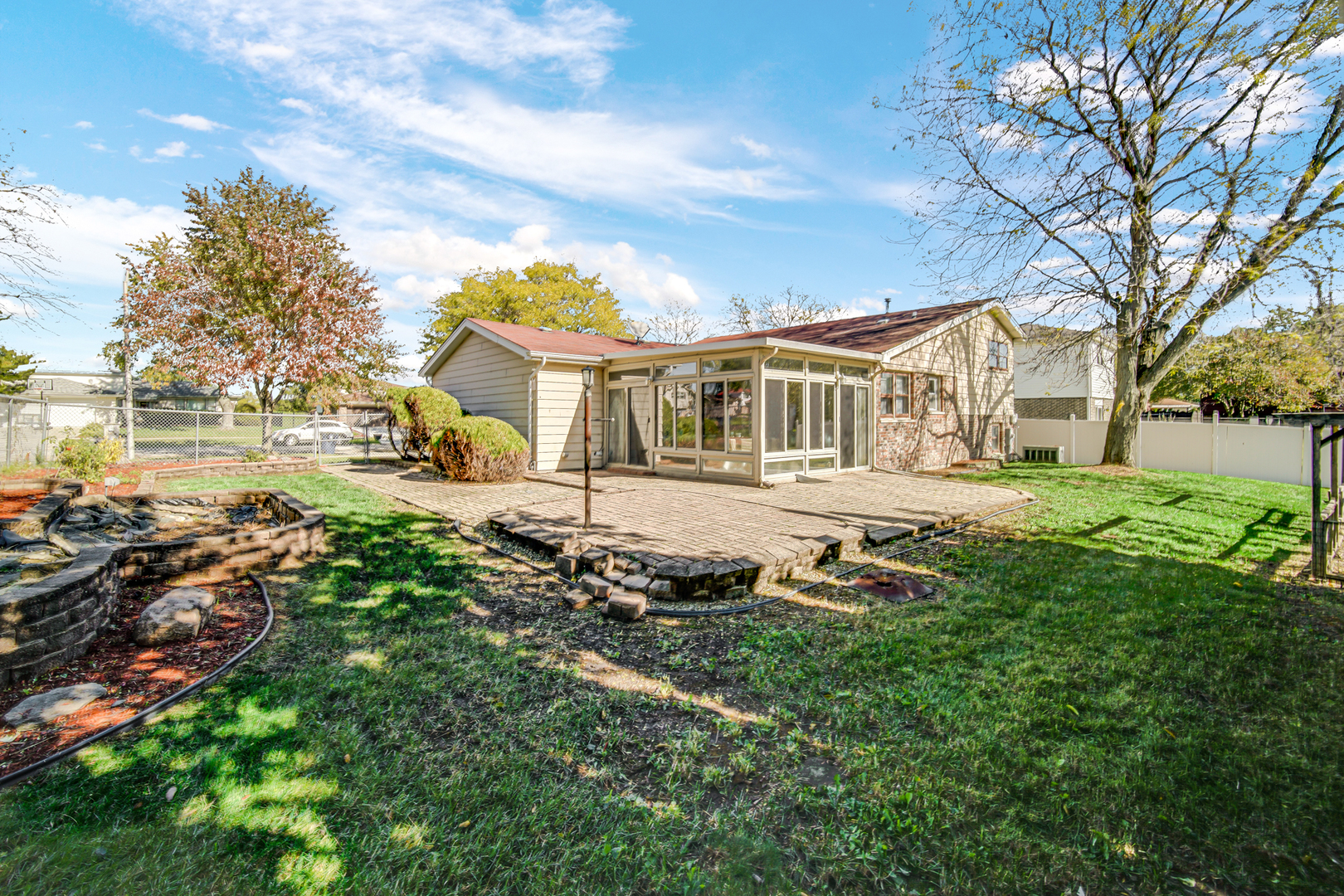 6159 Beechwood Road Matteson, IL 60443 - Photo 19 of 21 a front view of a house with a yard table and chairs