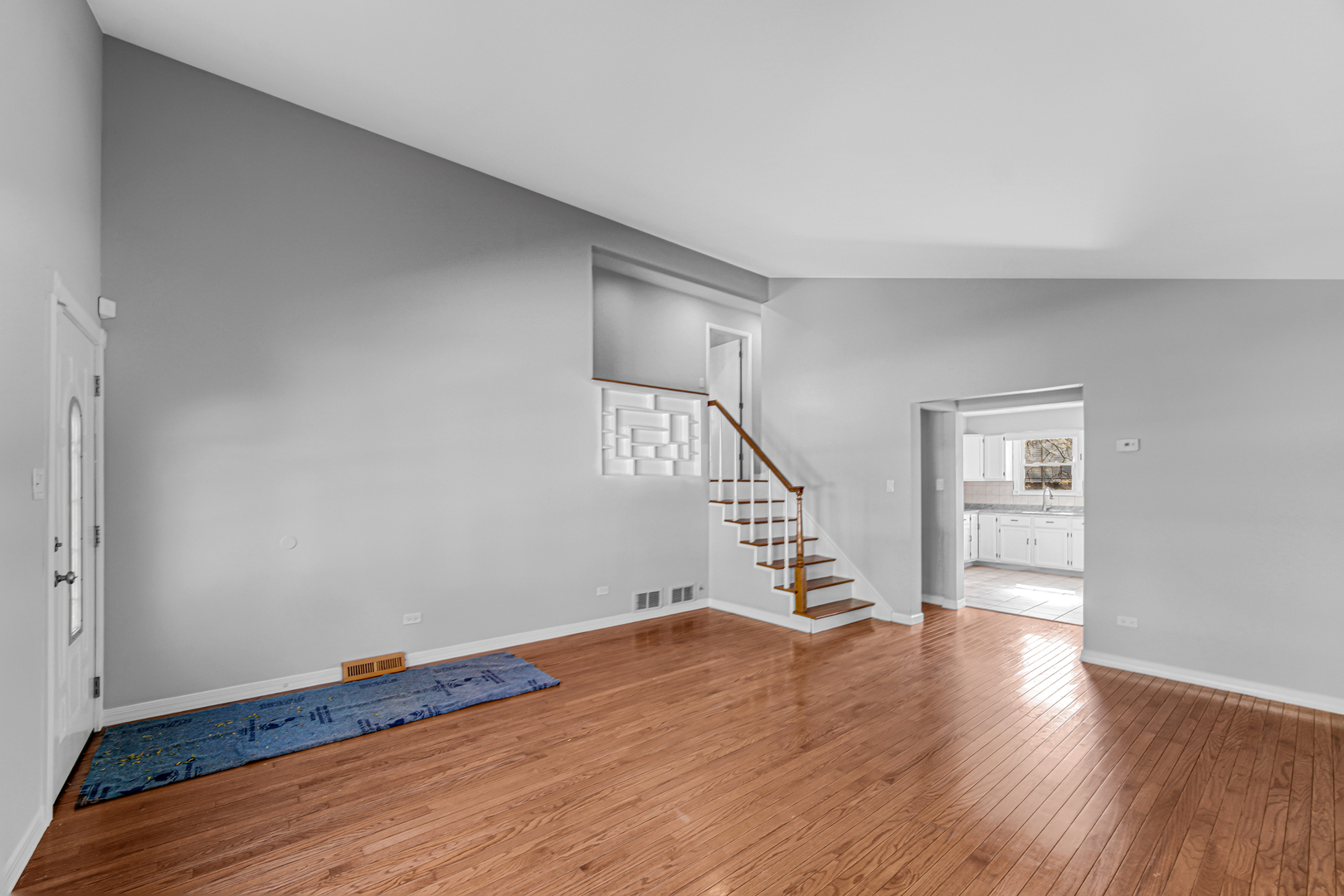 6159 Beechwood Road Matteson, IL 60443 - Photo 4 of 21 a view of an empty room with wooden floor and stairs
