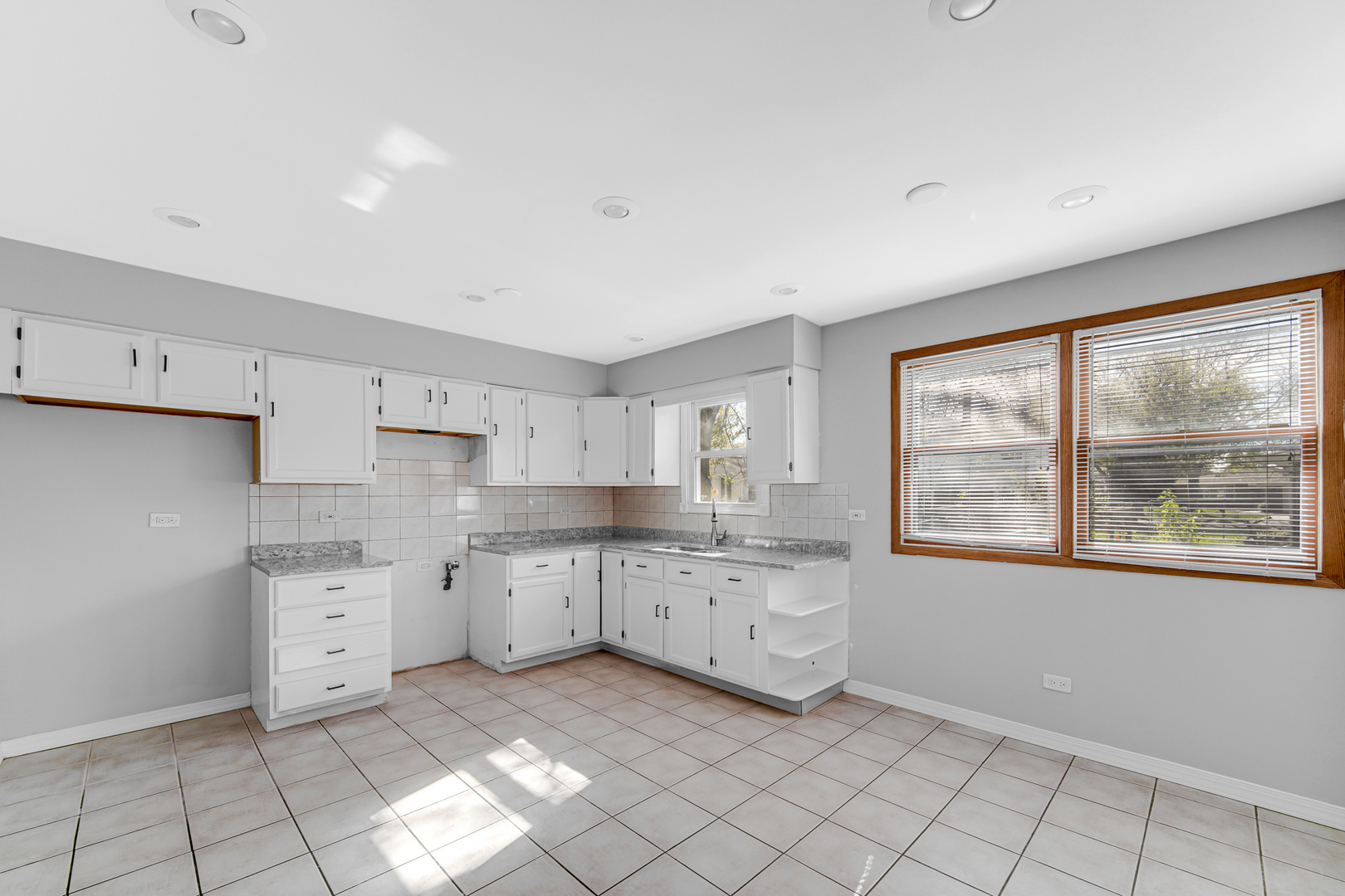 6159 Beechwood Road Matteson, IL 60443 - Photo 6 of 21 a kitchen with cabinets and window
