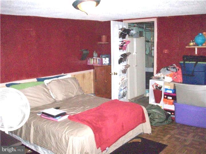 7119 Dungan Road Philadelphia, PA 19111 - Photo 11 of 15 a bedroom with a bed and a couch