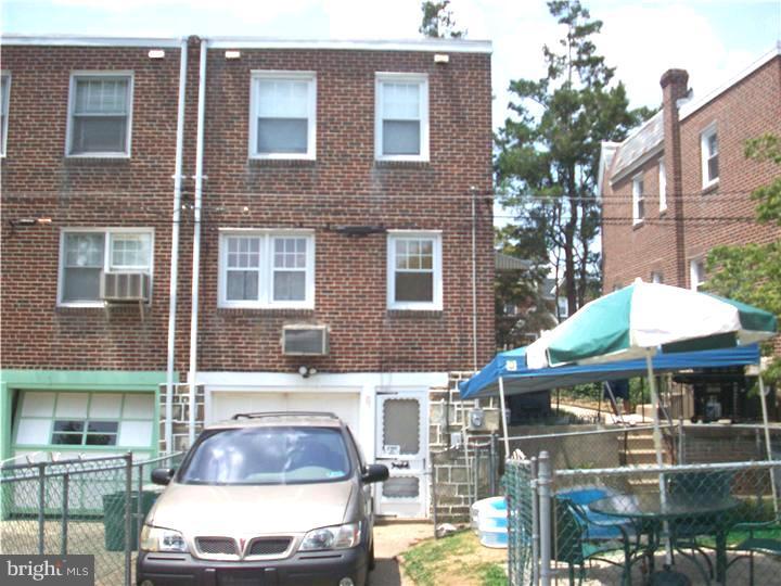 7119 Dungan Road Philadelphia, PA 19111 - Photo 15 of 15 a front view of a building with a yard