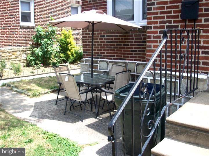 7119 Dungan Road Philadelphia, PA 19111 - Photo 3 of 15 a view of a patio with a table and chairs