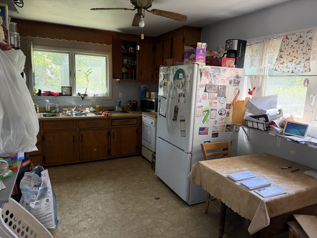 42 Birch Road Westford, MA 01886 - Photo 7 of 10 a kitchen with refrigerator and window
