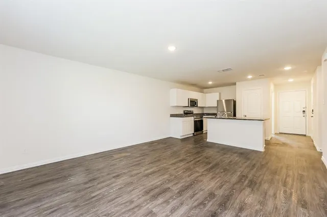 a view of kitchen with wooden floor