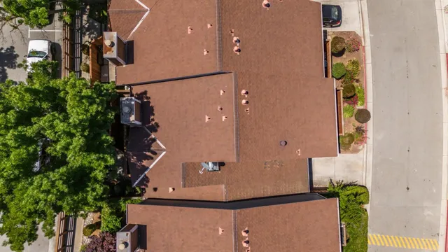 an aerial view of a house with a backyard