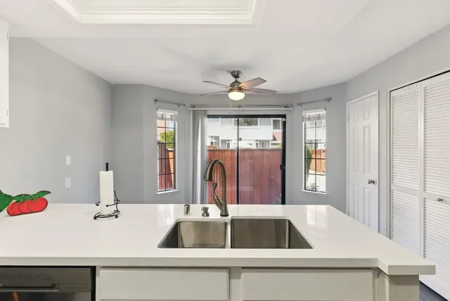 a kitchen with a sink and a refrigerator