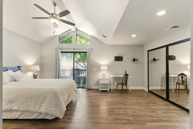 a bedroom with a bed and a table