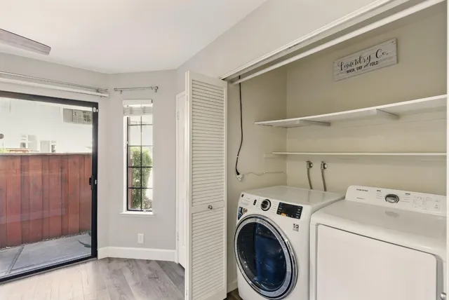 a view of storage and utility room with washer and dryer