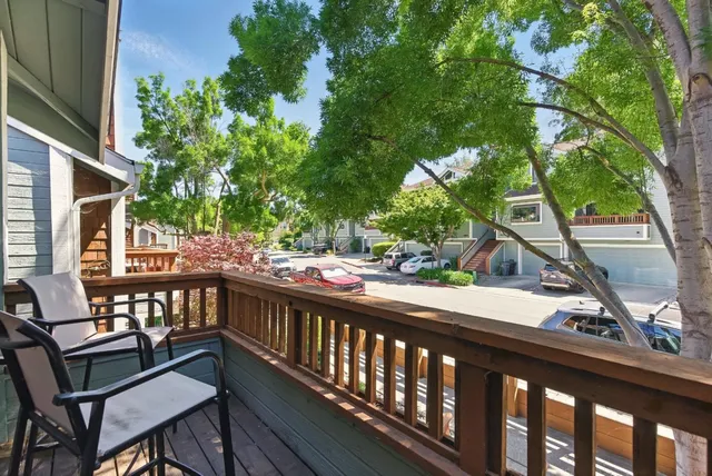 a view of a balcony with chairs