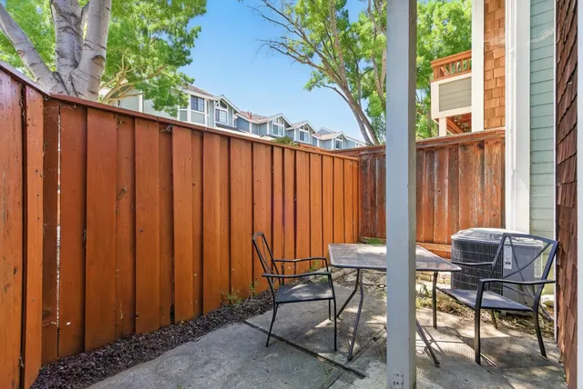a view of chair and table in patio