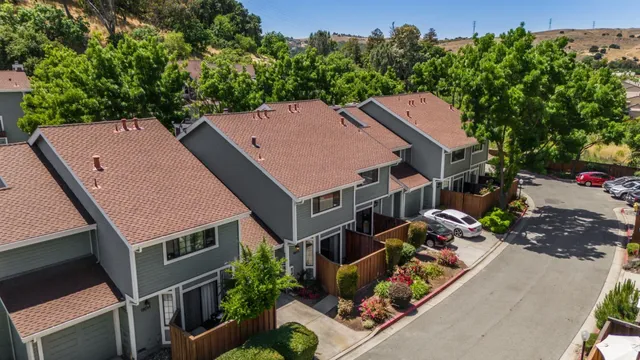 an aerial view of a house with a yard