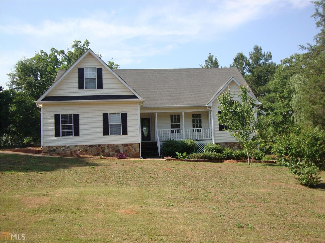 104 Whippoorwill Ridge Road Jackson, GA 30233 - Photo 1 of 1 a front view of a house with a yard