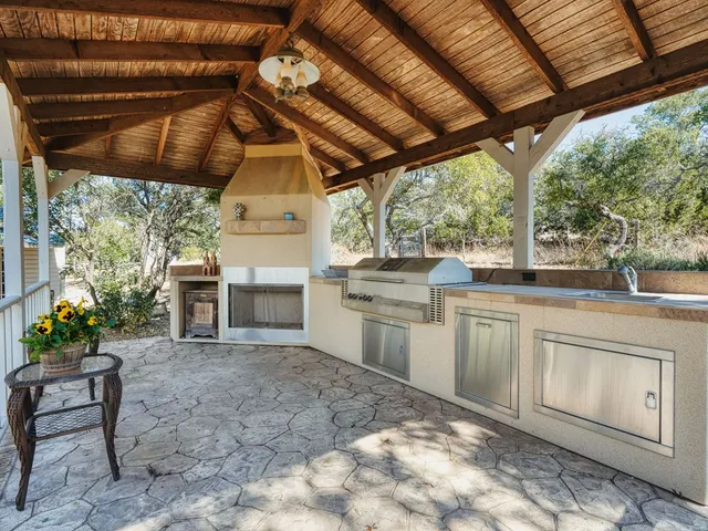 a view of a kitchen with a sink and cabinets