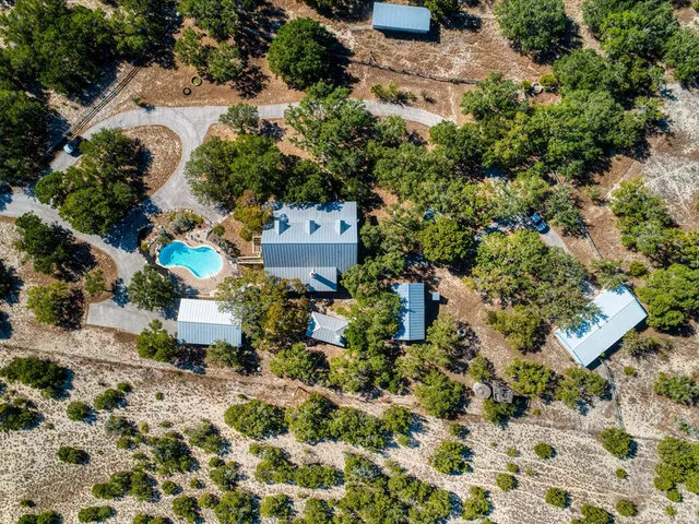 an aerial view of residential house with outdoor space