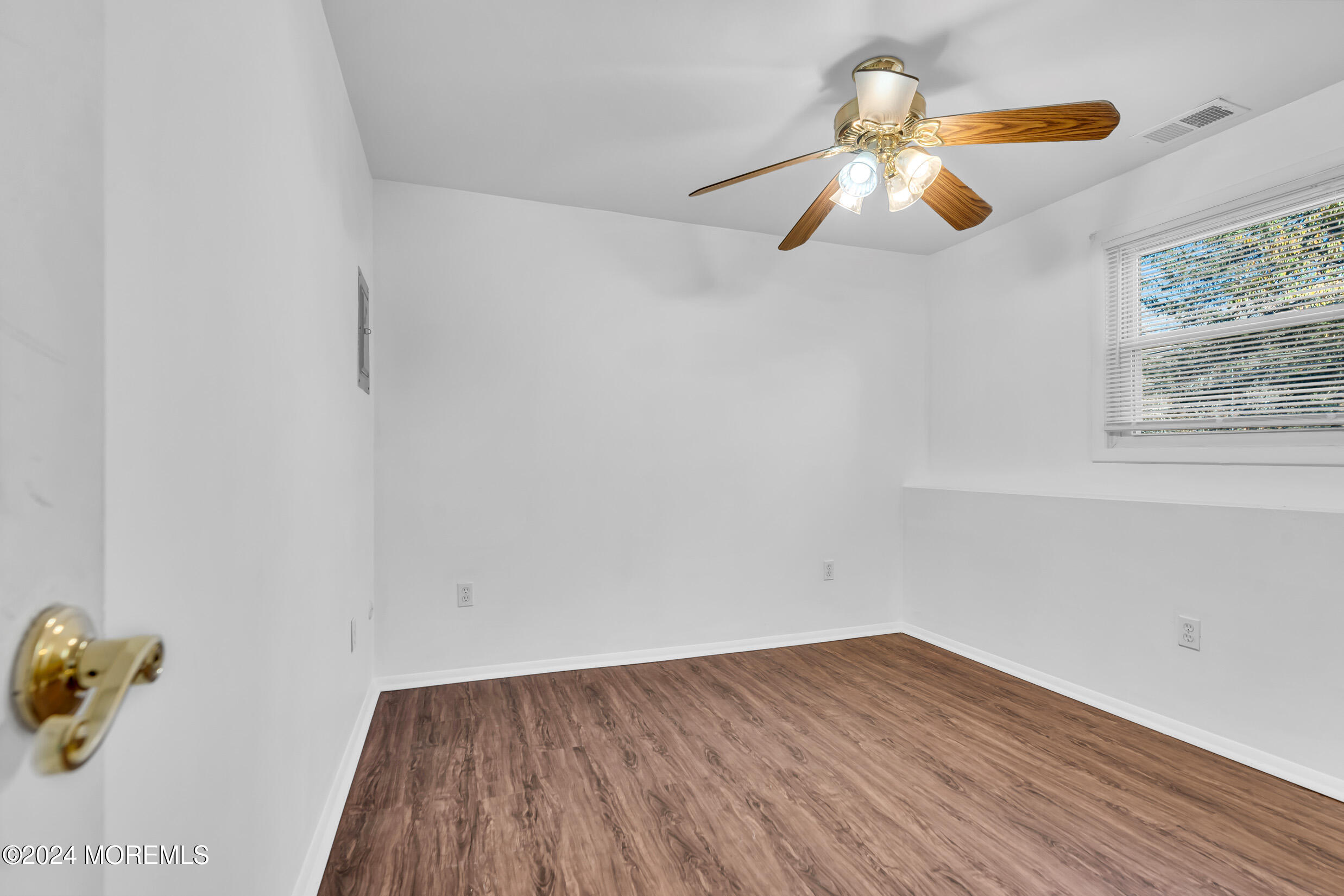 306 Cedar Swamp Road Jackson, NJ 08527 - Photo 34 of 52 a view of room with hardwood floor and a ceiling fan