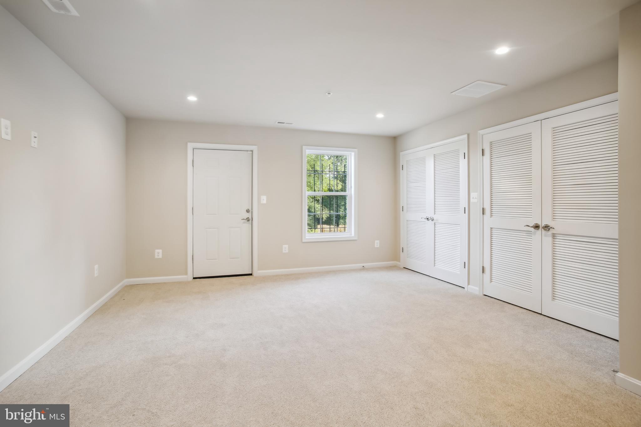 2433 Elvans Road Southeast Washington, DC 20020 - Photo 17 of 43 Recreation Room, Laundry + Access to Yard/ Parking