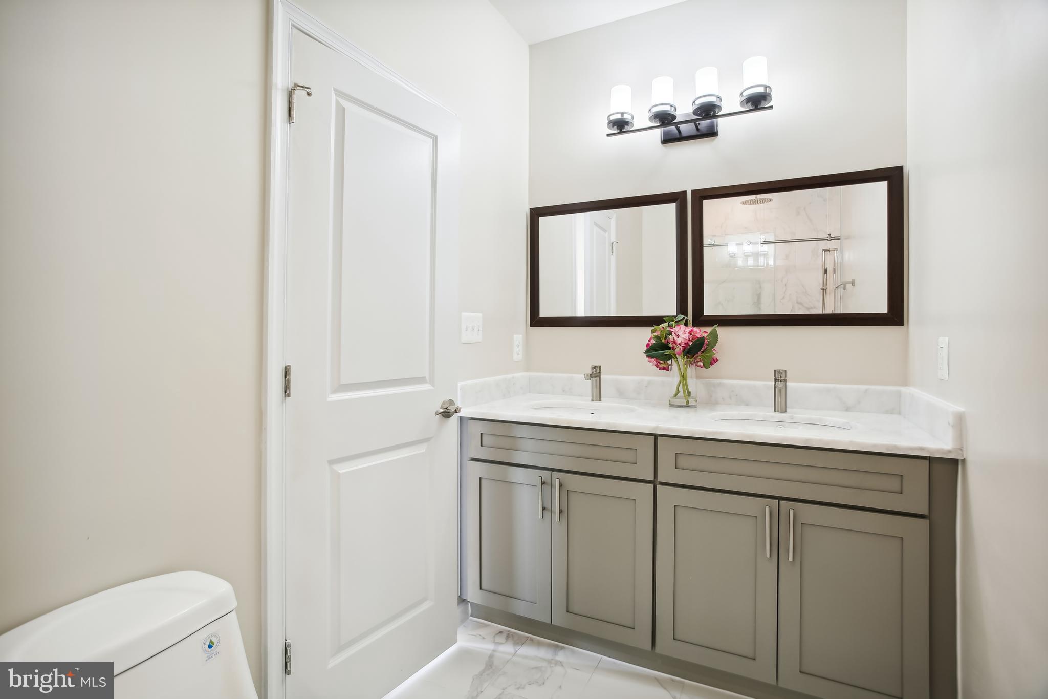 2433 Elvans Road Southeast Washington, DC 20020 - Photo 7 of 43 Primary Bathroom w/ Double Vanity - Upper Level