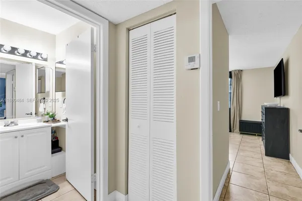 a view of a bathroom from the hallway