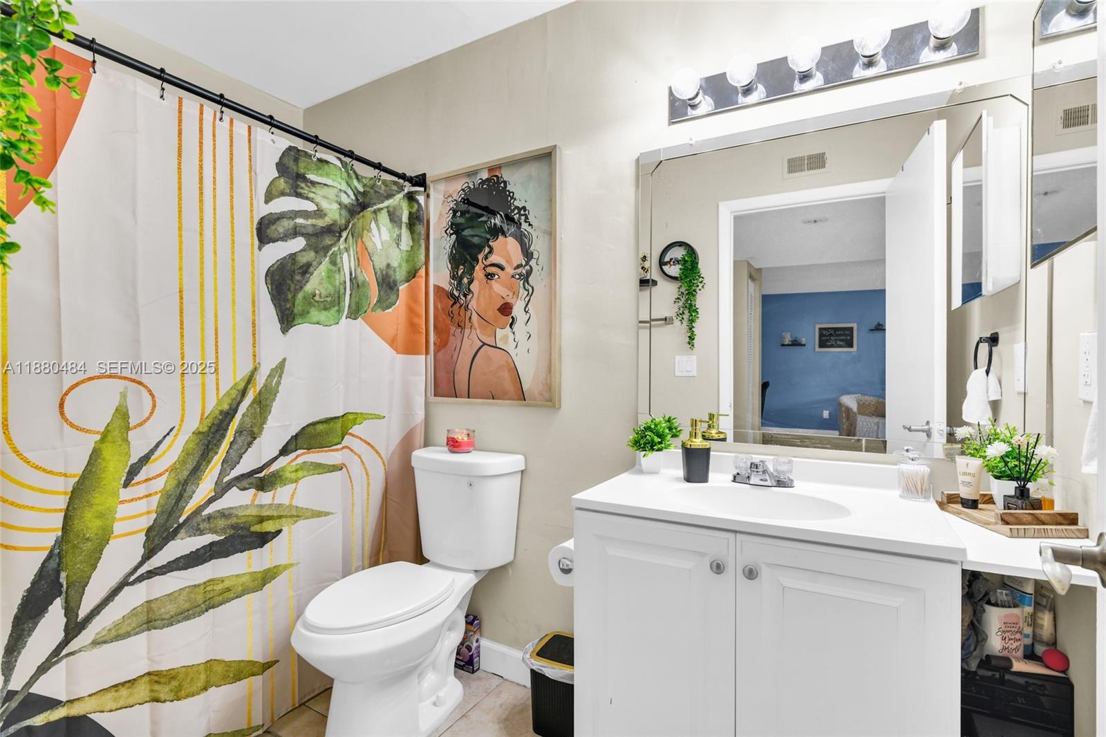 1255 Southwest 46th Avenue, Unit 1713 Pompano Beach, FL 33069 - Photo 18 of 37 a bathroom with a sink mirror vanity and toilet