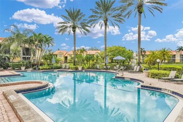 a view of a swimming pool with a lounge chairs