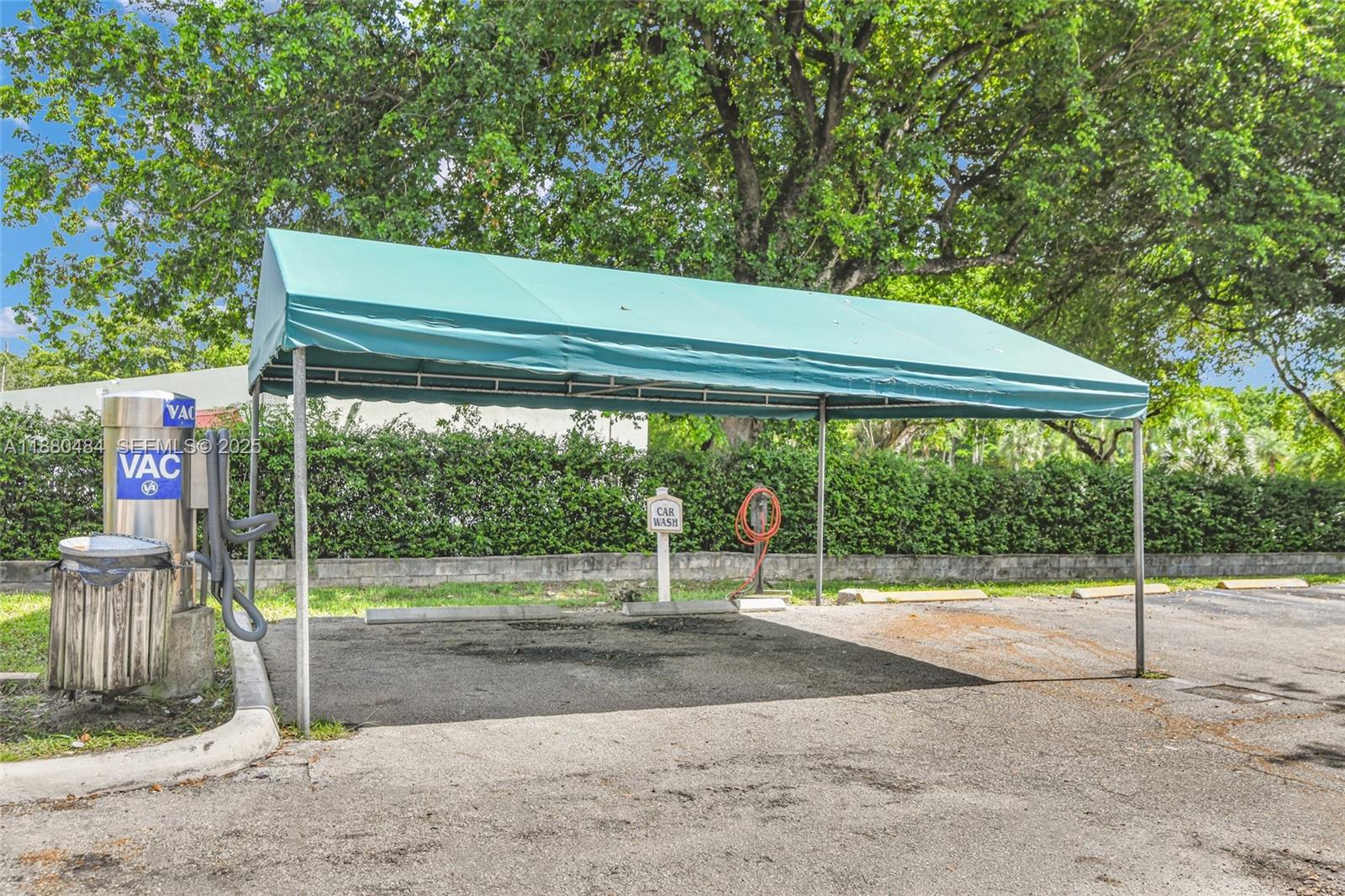 1255 Southwest 46th Avenue, Unit 1713 Pompano Beach, FL 33069 - Photo 37 of 37 a backyard of a house with a garden and entertaining space