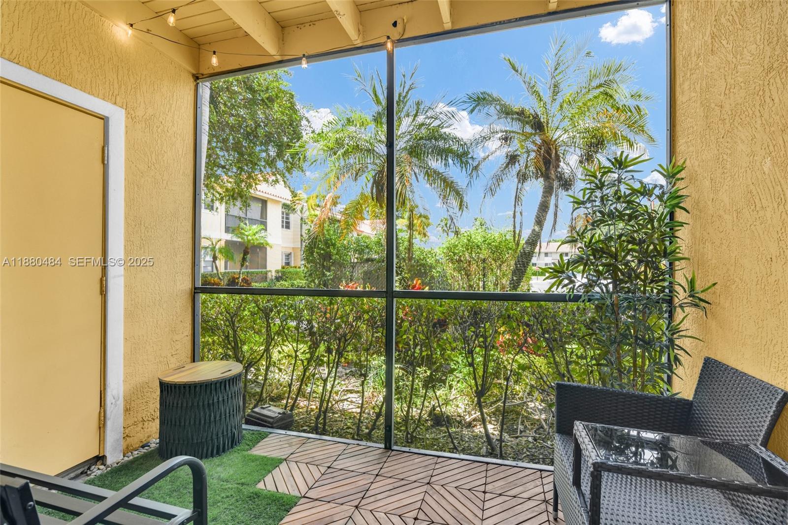 1255 Southwest 46th Avenue, Unit 1713 Pompano Beach, FL 33069 - Photo 4 of 37 a view of a chairs and table in a patio