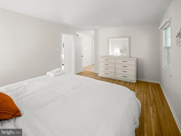 a spacious bathroom with a double vanity sink and a mirror