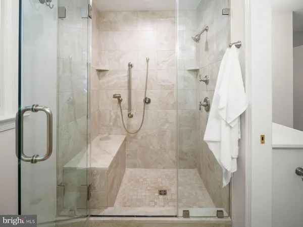 a bathroom with a sink vanity and a mirror