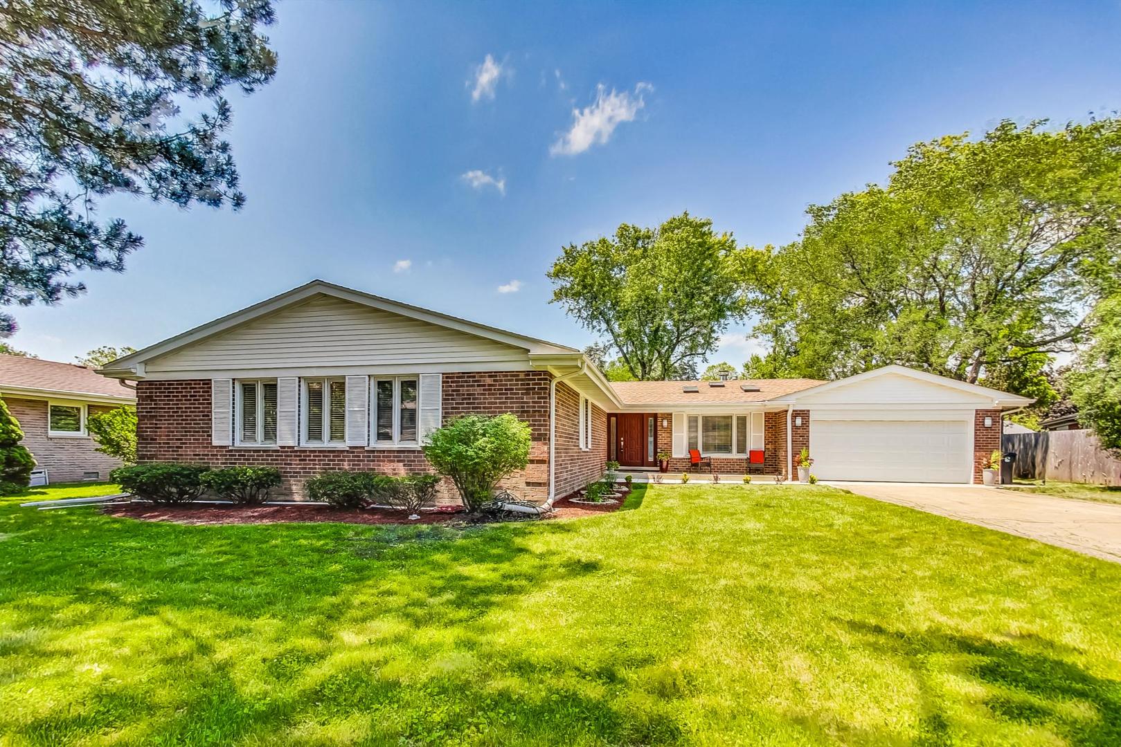 2030 Clover Road Northbrook, IL 60062 - Photo 1 of 44 a front view of a house with garden