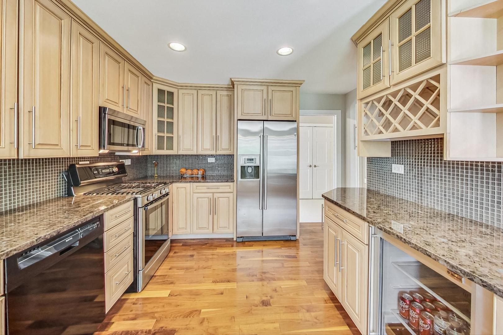 2030 Clover Road Northbrook, IL 60062 - Photo 12 of 44 a kitchen with stainless steel appliances granite countertop a stove a sink and a microwave