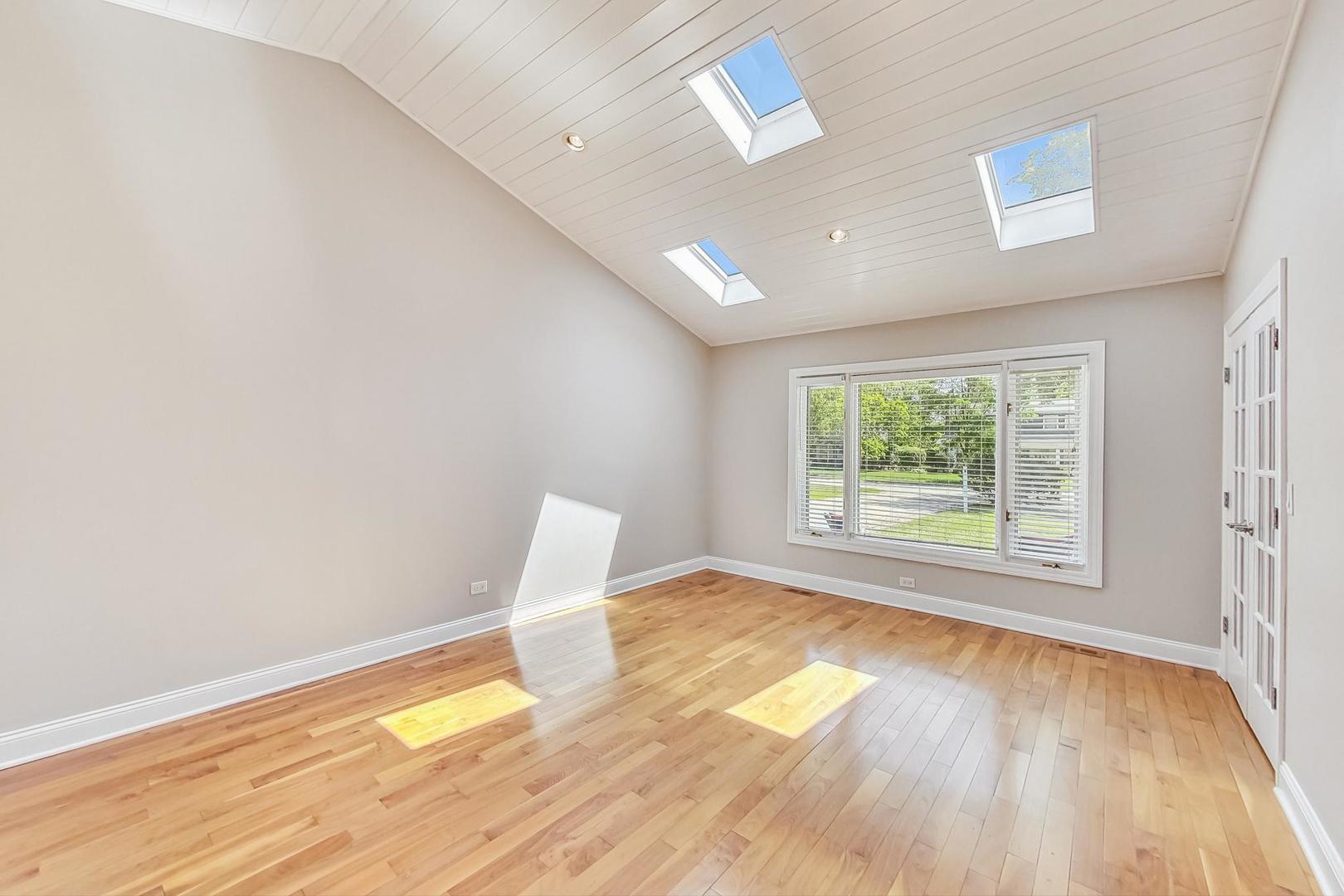 2030 Clover Road Northbrook, IL 60062 - Photo 15 of 44 wooden floor in an empty room with a window