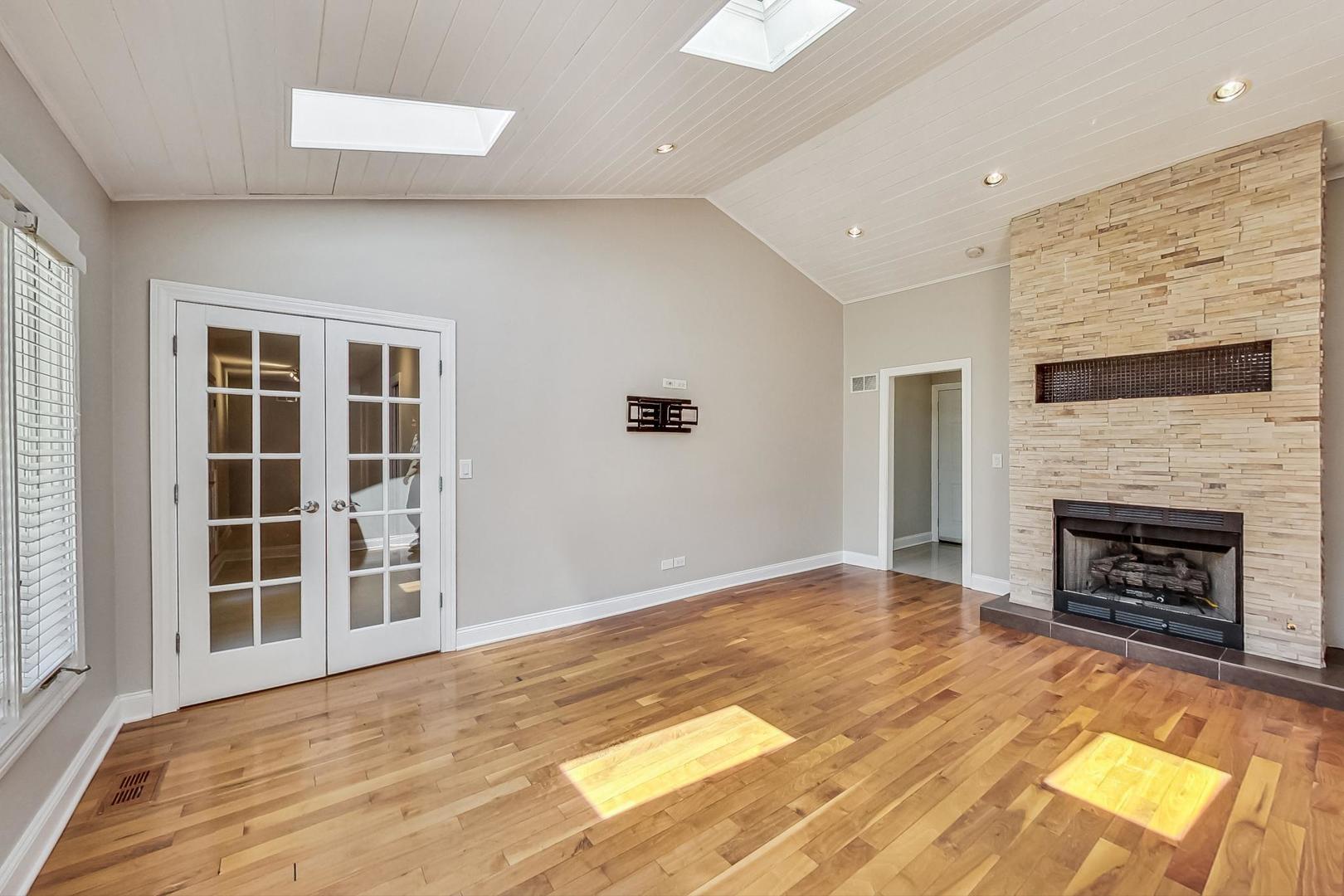 2030 Clover Road Northbrook, IL 60062 - Photo 17 of 44 a view of an empty room with a fireplace and a window