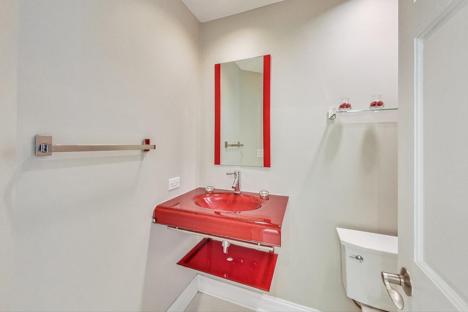 2030 Clover Road Northbrook, IL 60062 - Photo 18 of 44 a bathroom with a sink and a mirror