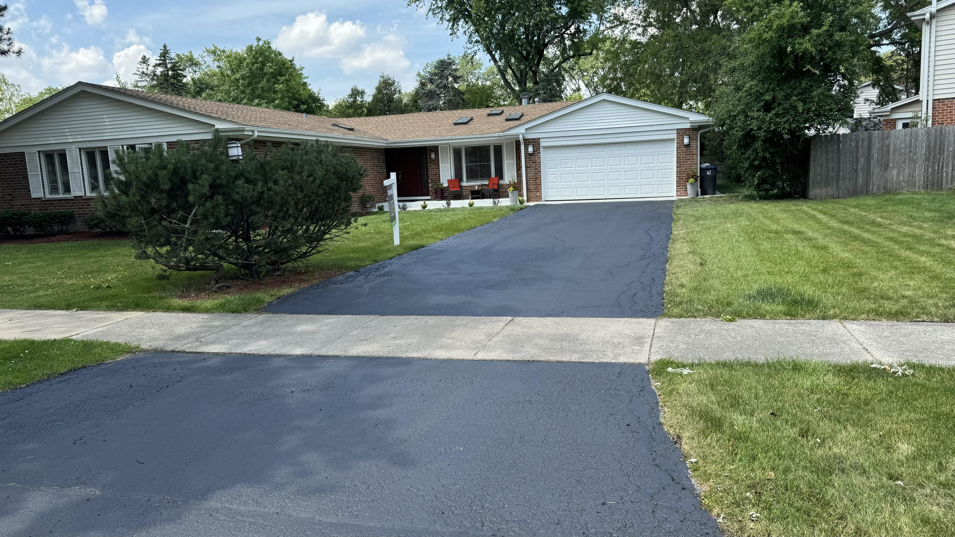 2030 Clover Road Northbrook, IL 60062 - Photo 2 of 44 a front view of a house with a yard and garage