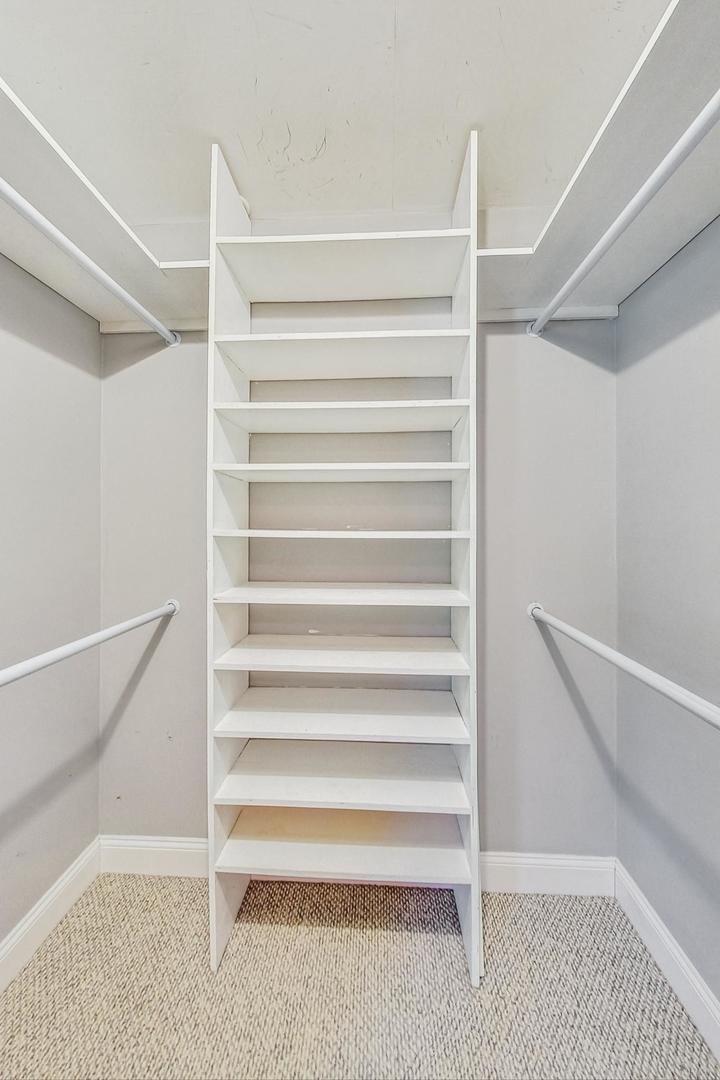 2030 Clover Road Northbrook, IL 60062 - Photo 22 of 44 a view of walk in closet with empty racks