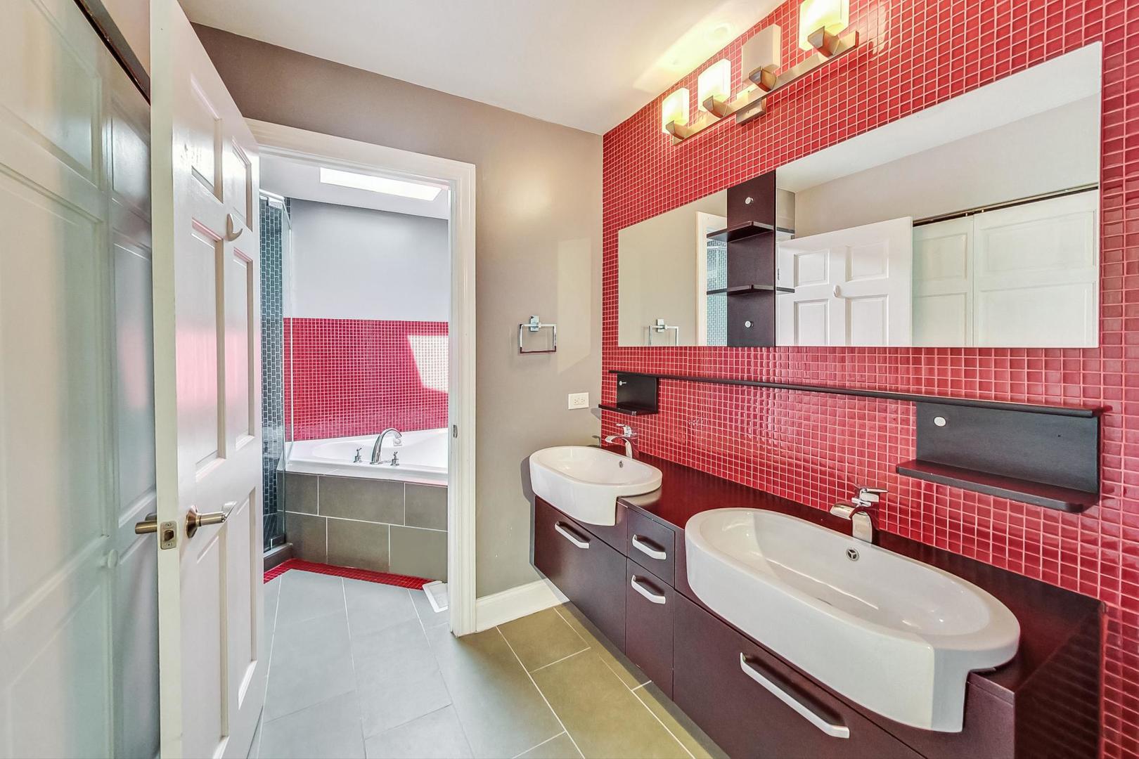 2030 Clover Road Northbrook, IL 60062 - Photo 23 of 44 a bathroom with a sink vanity tub and shower
