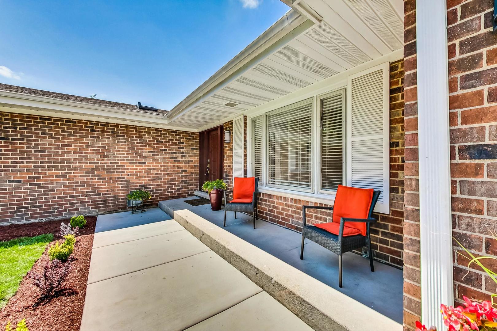 2030 Clover Road Northbrook, IL 60062 - Photo 3 of 44 a backyard of a house with barbeque oven table and chairs