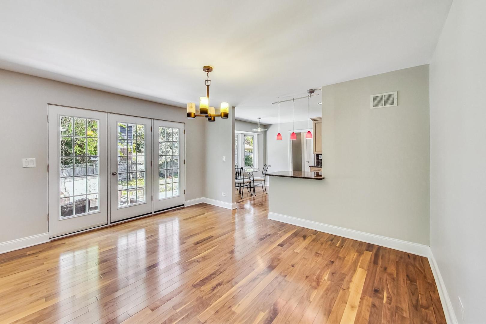 2030 Clover Road Northbrook, IL 60062 - Photo 9 of 44 a view of empty room with wooden floor and fan