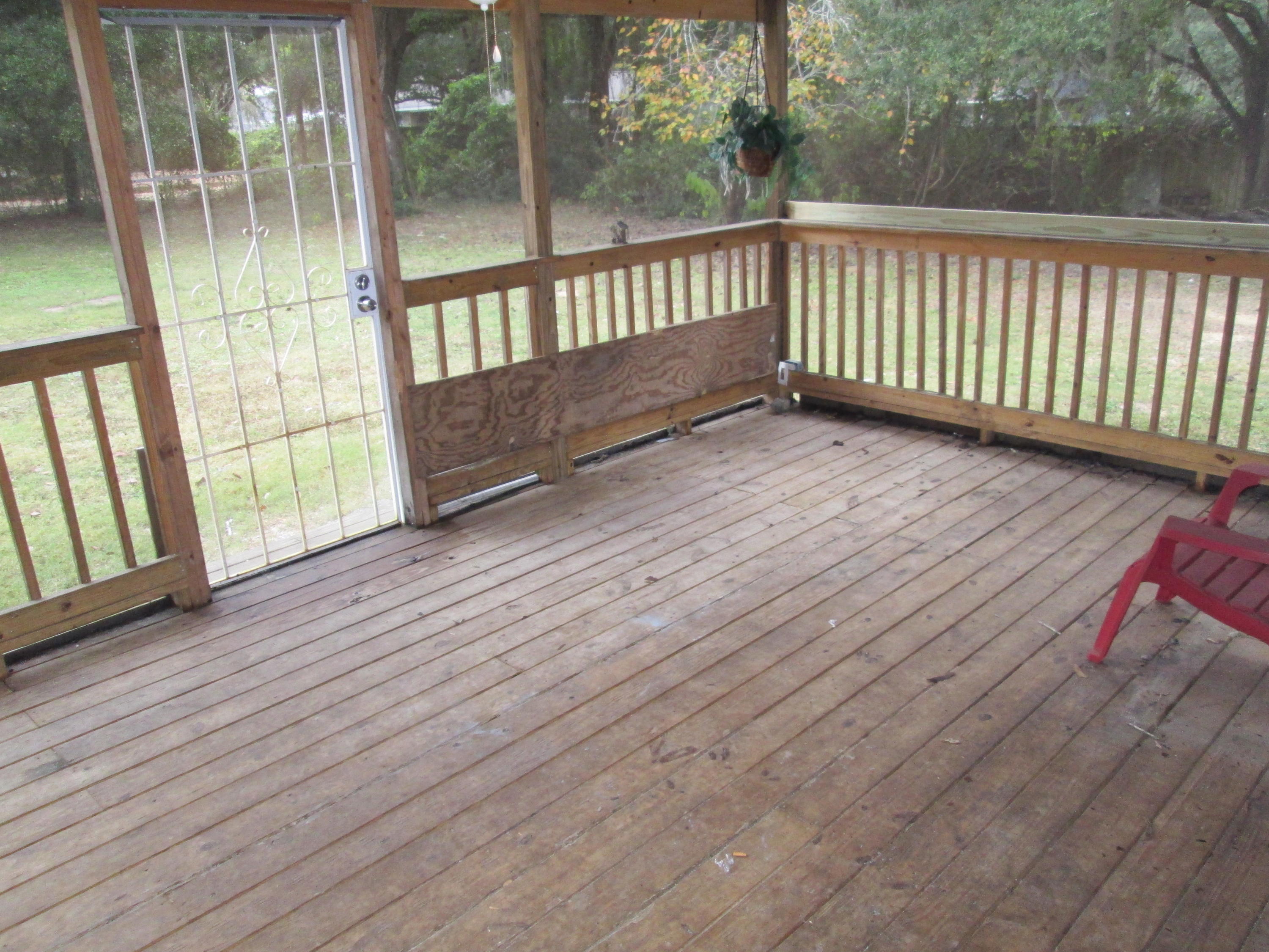 2765 Ola Broxson Road Navarre, FL 32566 - Photo 13 of 20 a view of a balcony with wooden floor