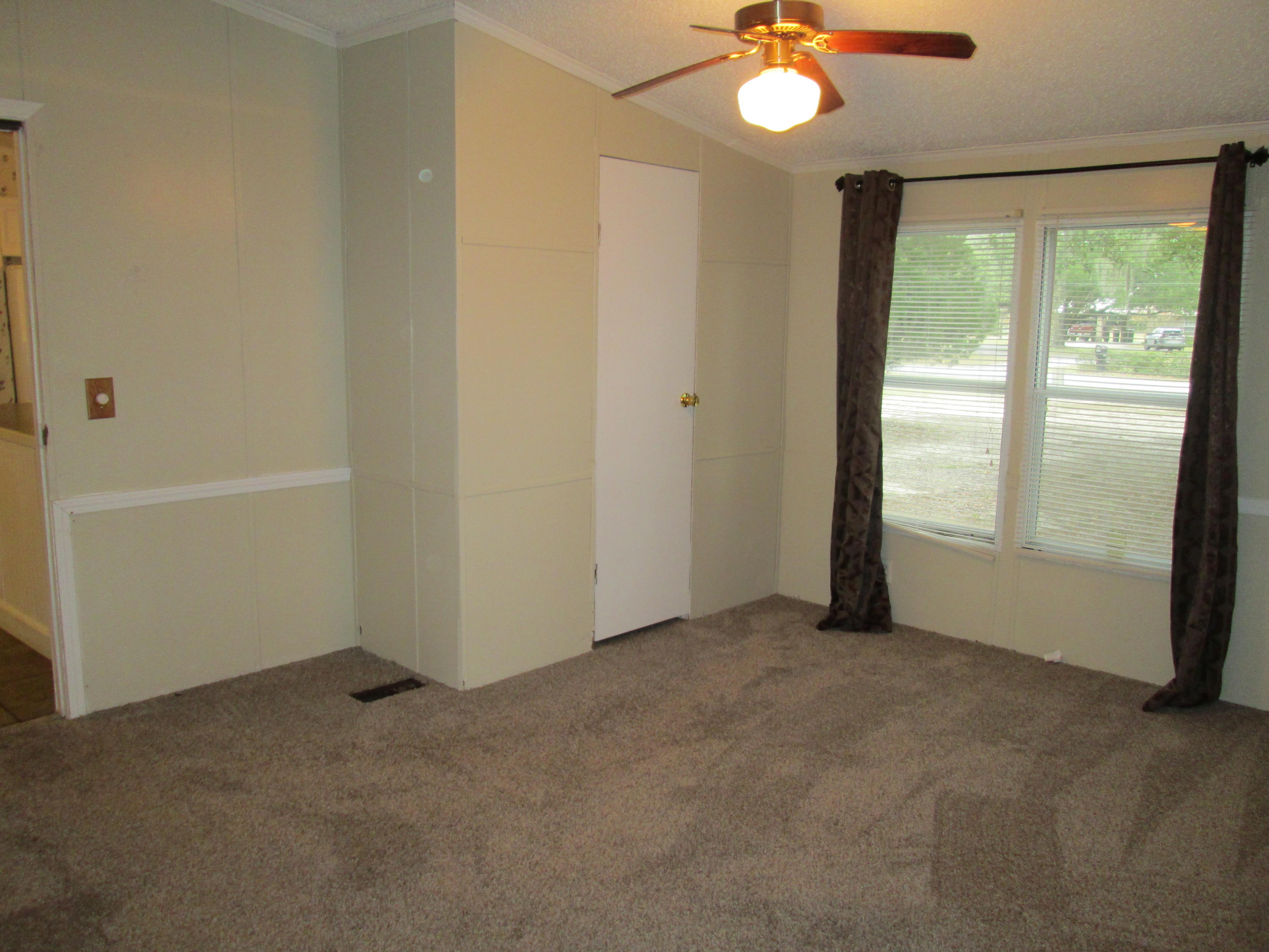 2765 Ola Broxson Road Navarre, FL 32566 - Photo 14 of 20 a view of an empty room with a window