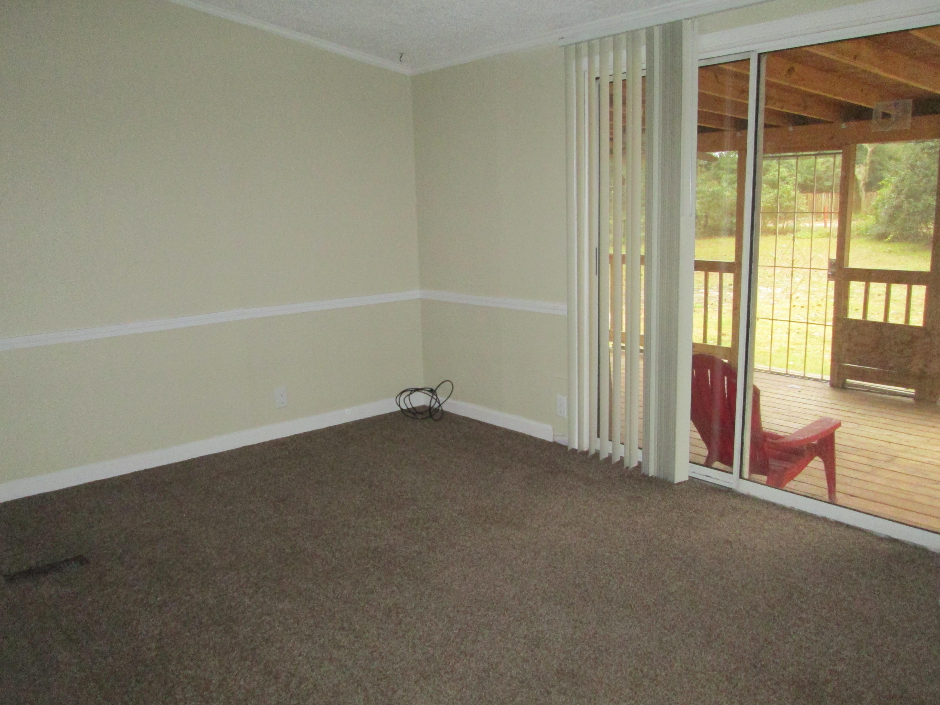 2765 Ola Broxson Road Navarre, FL 32566 - Photo 17 of 20 an empty room with an entryway