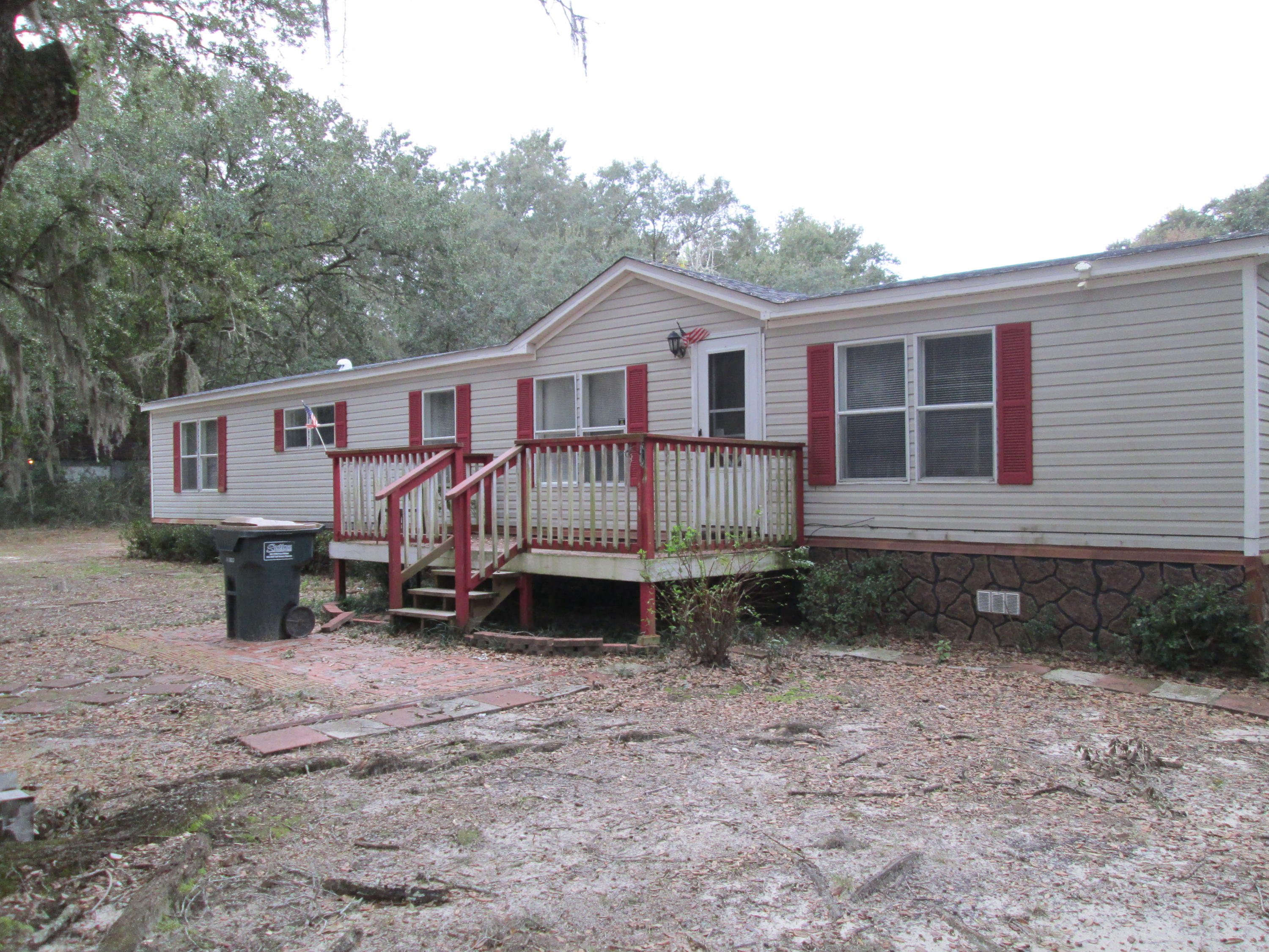 2765 Ola Broxson Road Navarre, FL 32566 - Photo 2 of 20 a view of a house with a yard and fence