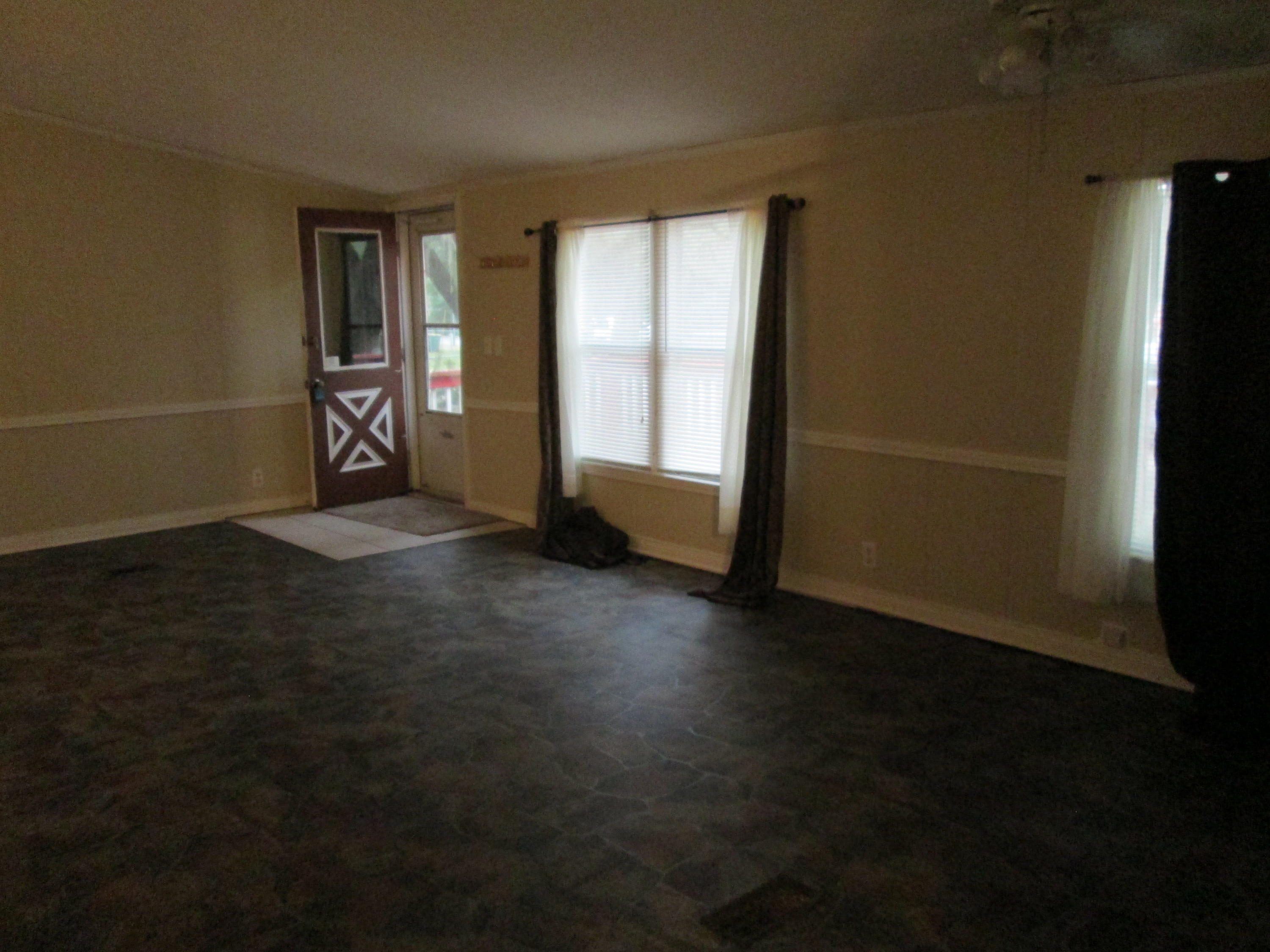 2765 Ola Broxson Road Navarre, FL 32566 - Photo 9 of 20 an empty room with windows