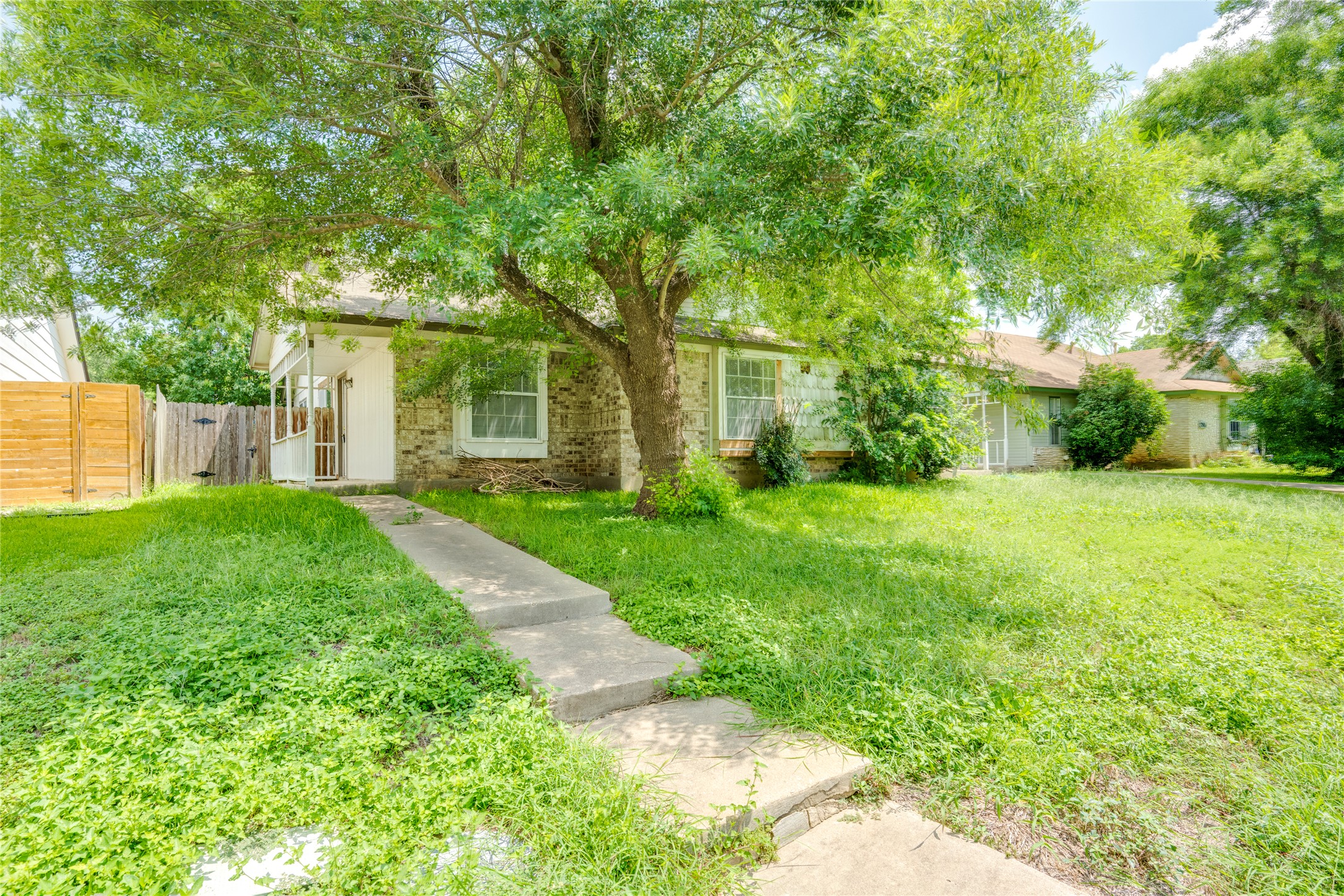 7918 West Gate Boulevard Austin, TX 78745 - Photo 28 of 31 Mature trees shade this charming residence with a welcoming front porch.